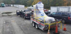 photo of an oversized Timberland workboot being transported